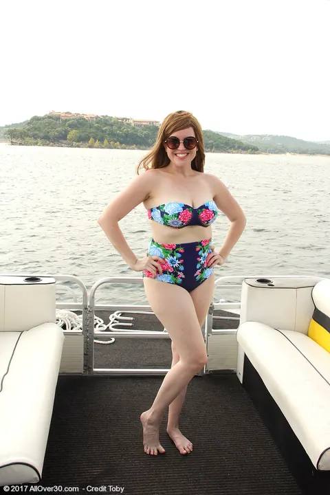 Holly Fuller: BBW Redhead in a Bikini and Glasses Flaunts Her Curves on a Boat – photo 1 of 15