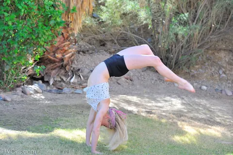 Blonde in Shorts Spreads Her Legs Outdoors – photo 9 of 21