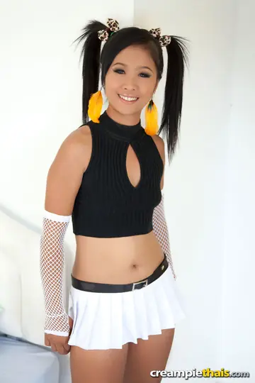 Skinny Thai Brunette Lifts Her Skirt and Spreads Her Shaved Pussy