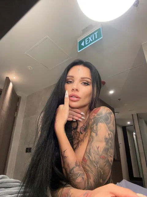 Brunette with Big Tits and a Round Ass Shows Off Her Tattoos – photo 4 of 13