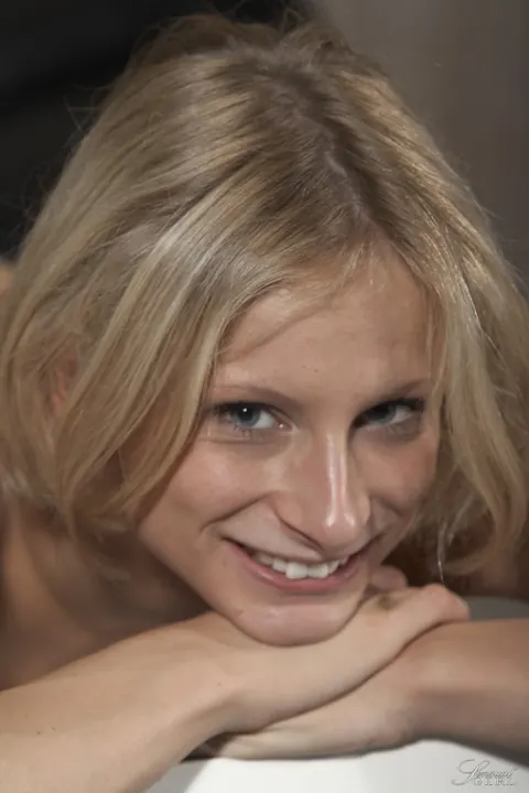 Paris Pink: Slim German Blonde Spreads Her Shaved Pussy for the Camera – photo 12 of 18