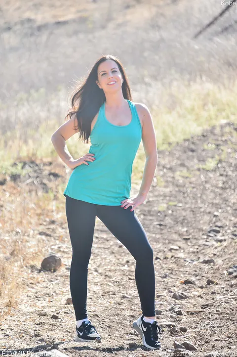 Kobe Lee: Mature Brunette MILF Flashes Her Small Tits in Jeans Outdoors – photo 7 of 17