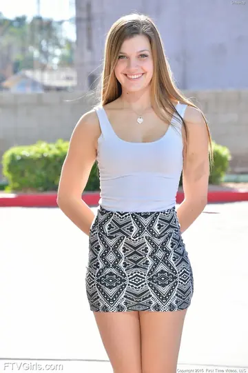 Blonde in a Skirt and Heels Spreads Her Shaved Pussy Outside