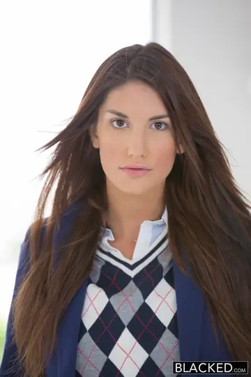 August Ames – Busty Tattooed Brunette Takes a BBC Facial