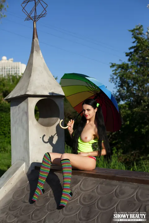 Pale Brunette in Pigtails and Socks Spreads on a Balcony – photo 1 of 20