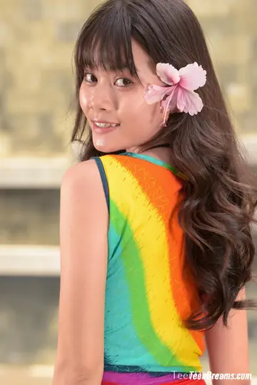 Asian Woman in a Skirt and Bikini Spreads Her Pussy