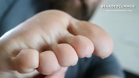 Man Lifts His Foot to His Mouth on the Sofa – photo 9 of 15