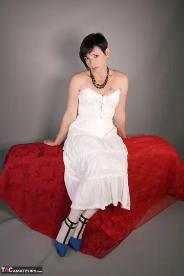 Short-Haired Brunette MILF Models Lingerie and Heels