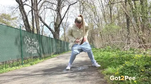 European Blonde Pulls Down Her Jeans to Pee Outdoors – photo 14 of 15