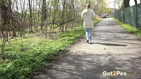 European Blonde Pulls Down Her Jeans to Pee Outdoors – photo 15 of 15