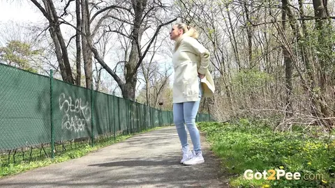 European Blonde Pulls Down Her Jeans to Pee Outdoors – photo 3 of 15