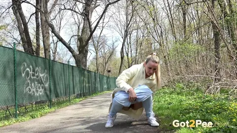 European Blonde Pulls Down Her Jeans to Pee Outdoors – photo 4 of 15