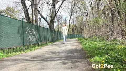 European Blonde Pulls Down Her Jeans to Pee Outdoors – photo 1 of 15