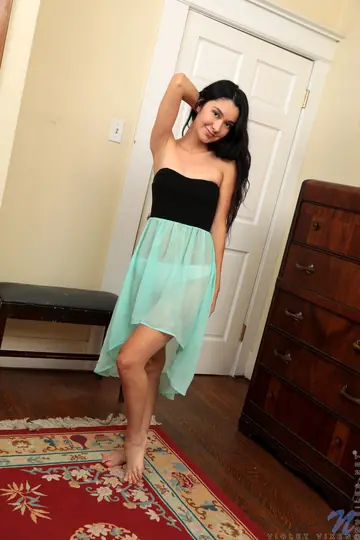 Brunette in a Skirt Uses a Glass Dildo and Spreads Her Shaved Pussy