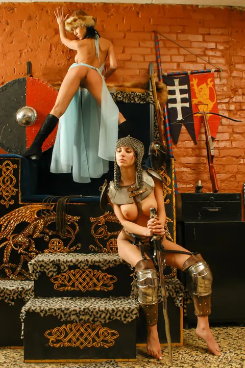 Two Busty Brunettes in Medieval Costumes and Boots Spread Wide – photo 7 of 16