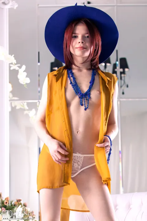 Pale Redhead in Sun Hat Poses and Spreads Her Hairy Pussy – photo 3 of 20