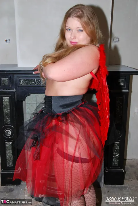 Thick Blonde MILF Flaunts Her Big Tits and Ass in Costume – photo 9 of 16