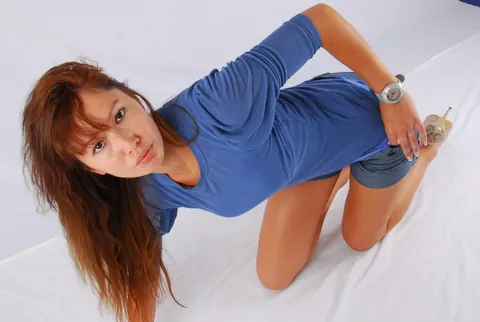 Asian Redhead Strips Out of Her Shorts and Heels to Spread Her Legs – photo 12 of 16