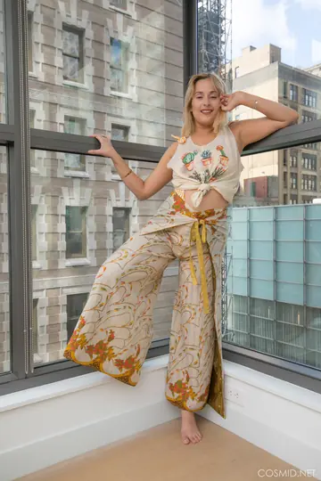 Busty Blonde Strips Out of Her Lingerie by the Condo Window