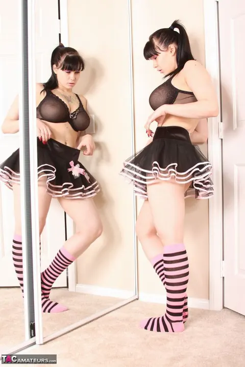 Jennique Adams: Brunette MILF in Lingerie, Skirt and Socks Poses in the Mirror – photo 15 of 20