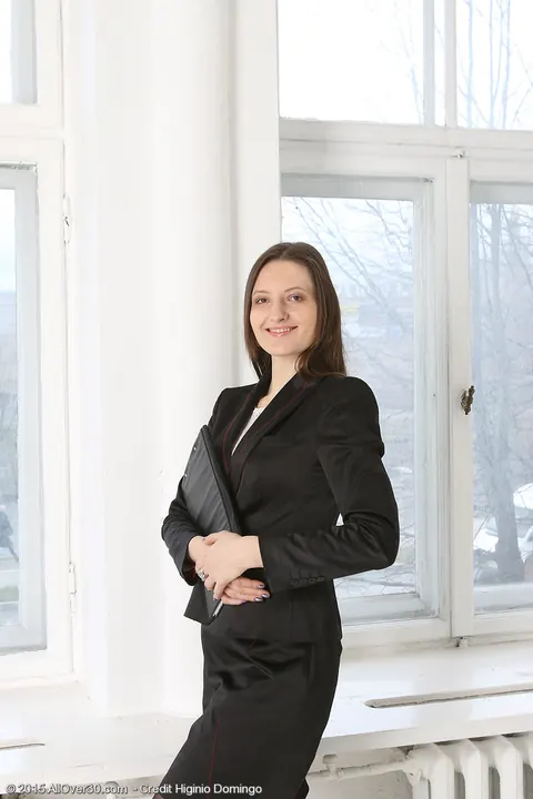 Mariona: Mature Brunette Strips Out of Business Attire in the Office – photo 2 of 15