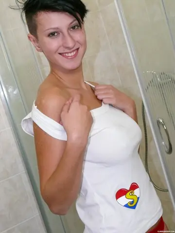 Busty European with Short Hair Fingers Her Pussy in the Bathroom