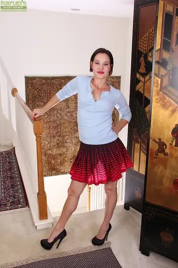 Short-Haired Brunette MILF Lifts Her Skirt to Spread Her Hairy Pussy
