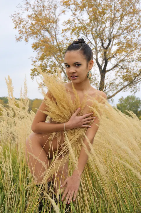 Tanned Woman Poses Nude and Strips for the Camera – photo 21 of 21