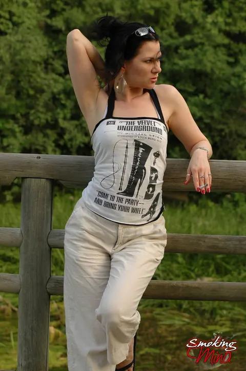 Brunette PAWG Poses Fully Clothed Outdoors by a Fence – photo 6 of 15