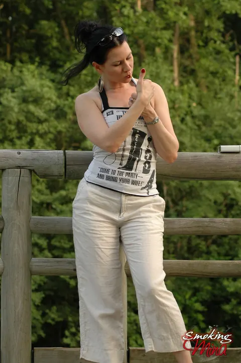 Brunette PAWG Poses Fully Clothed Outdoors by a Fence – photo 1 of 15