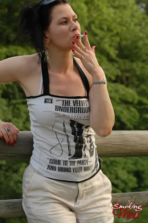 Brunette PAWG Poses Fully Clothed Outdoors by a Fence – photo 10 of 15