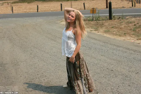 Meet Madden: Slim Blonde MILF Strips Off Her Skirt by the River in a Bikini – photo 1 of 15