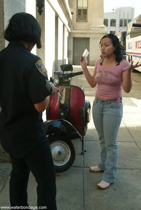DragonLily: Asian Brunette in Glasses Bound by Police Officer Outdoors – photo 5 of 20