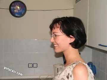 Short-Haired Brunette in Glasses Strips to Heels and Fucks a Dildo