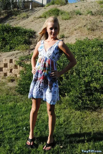 Blonde Amateur Flashes Her Tattooed Body in a Garden Dress