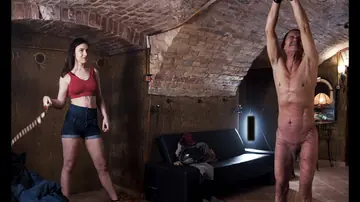 Brunette MILF in Shorts Canes Tied-Up Slave and Kisses Him