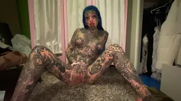 Tattooed Blonde Spreads Her Shaved Pussy in the Bathroom