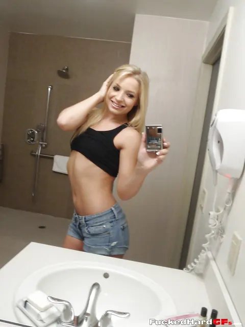 Slim Blonde Poses in Shorts for Bathroom Mirror Selfie – photo 7 of 16