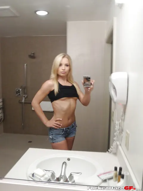 Slim Blonde Poses in Shorts for Bathroom Mirror Selfie – photo 3 of 16