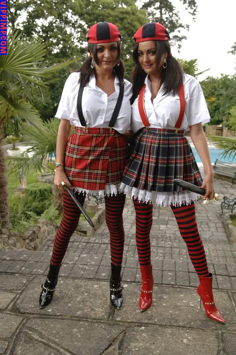 Pigtailed Woman in Uniform Skirt and Stockings Spreads Outdoors – photo 9 of 15