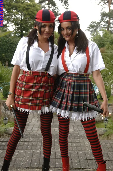 Pigtailed Woman in Uniform Skirt and Stockings Spreads Outdoors – photo 10 of 15