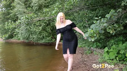 European Blonde in a Skirt Poses Outdoors – photo 2 of 15