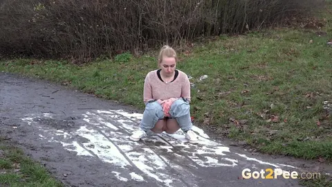 Woman Pulls Down Her Jeans and Spreads Her Shaved Pussy to Pee Outdoors – photo 2 of 15