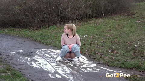 Woman Pulls Down Her Jeans and Spreads Her Shaved Pussy to Pee Outdoors – photo 3 of 15