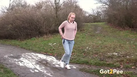 Woman Pulls Down Her Jeans and Spreads Her Shaved Pussy to Pee Outdoors – photo 15 of 15