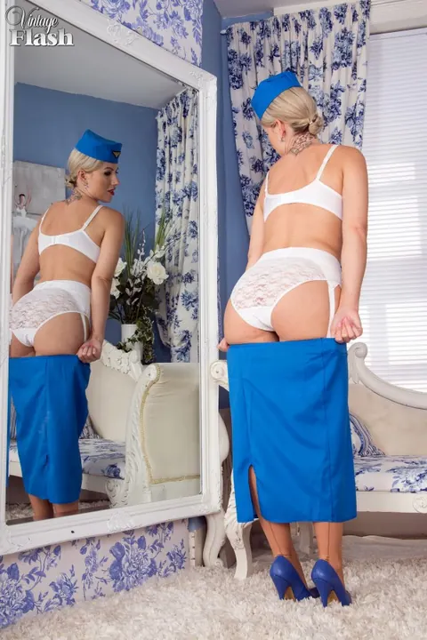 Busty MILF Strips Off Her Vintage Uniform for Lingerie and Stockings – photo 9 of 15