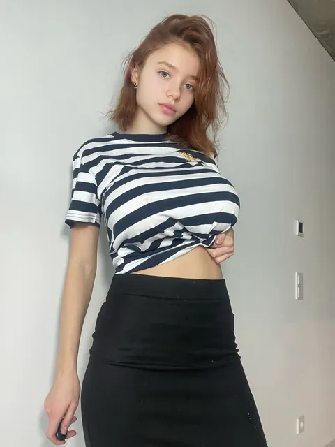 Skinny Redhead with Big Tits Poses in Outfits – photo 1 of 11