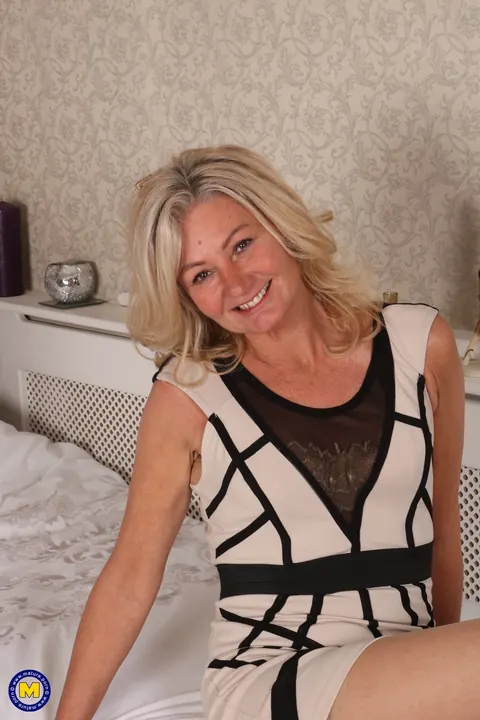 British Blonde MILF Strips Off Her Dress and Shows Her Hairy Muff – photo 2 of 20