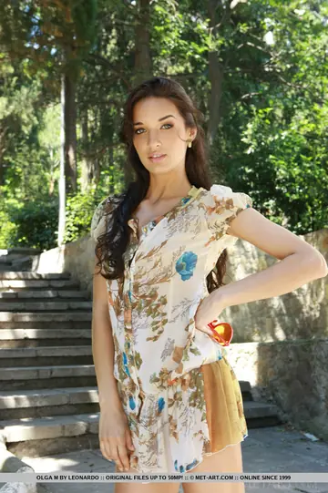 Slim European Woman Poses in a Skirt on the Beach