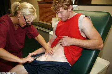 Tall Mature Blonde in Glasses Jerks Cock in Uniform and Takes a Facial